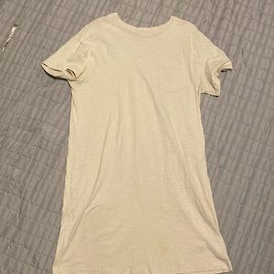 Knee length cream dress.